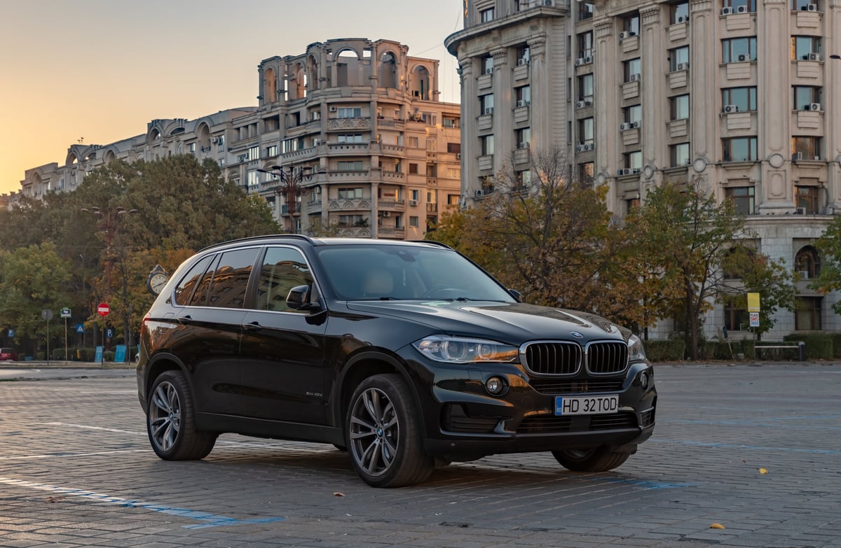 BMW X5 parked at golden hour before a mobile service visit